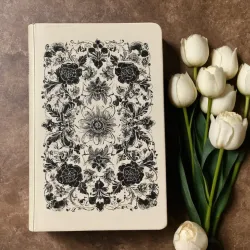 photo of #4 white book with black floral pattern