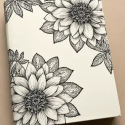 photo of #4 white book with black floral pattern