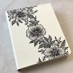 photo of #4 white book with black floral pattern
