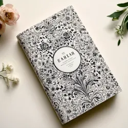 photo of #4 white book with black floral pattern