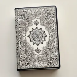photo of #4 white book with black floral pattern
