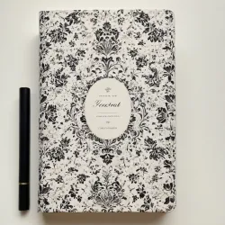 photo of #4 white book with black floral pattern