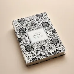 photo of #4 white book with black floral pattern