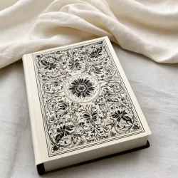 photo of #4 white book with black floral pattern