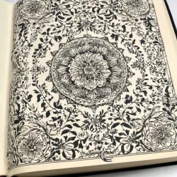 photo of #4 white book with black floral pattern
