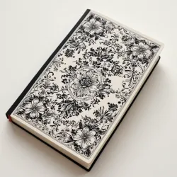 photo of #4 white book with black floral pattern