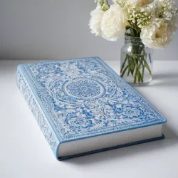 photo of #5 white book with blue floral pattern