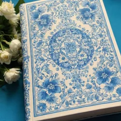 photo of #5 white book with blue floral pattern