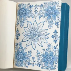 photo of #5 white book with blue floral pattern