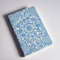 photo of #5 white book with blue floral pattern