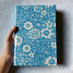 photo of #5 white book with blue floral pattern