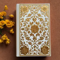 photo of #7 white book with golden floral pattern