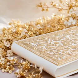 photo of #7 white book with golden floral pattern