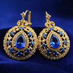 photo of #3 golden earrings with blue gem