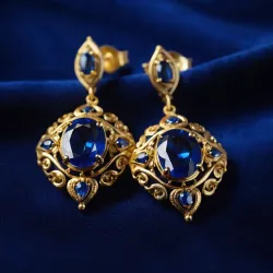 photo of #3 golden earrings with blue gem