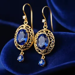 photo of #3 golden earrings with blue gem