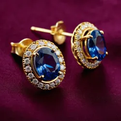 photo of #3 golden earrings with blue gem