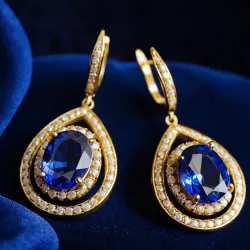photo of #3 golden earrings with blue gem