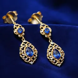 photo of #3 golden earrings with blue gem