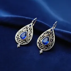 photo of #5 silver earrings with blue gem