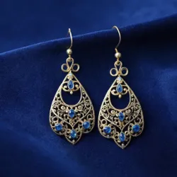 photo of #5 silver earrings with blue gem