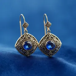 photo of #5 silver earrings with blue gem