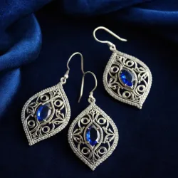 photo of #5 silver earrings with blue gem