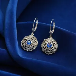 photo of #5 silver earrings with blue gem