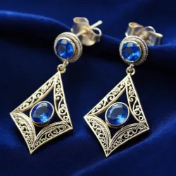 photo of #5 silver earrings with blue gem