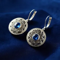 photo of #5 silver earrings with blue gem