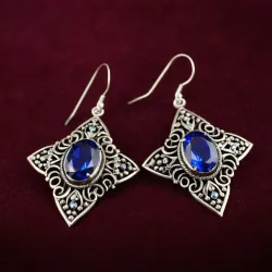 photo of #5 silver earrings with blue gem