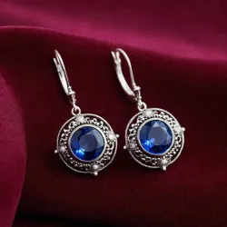 photo of #5 silver earrings with blue gem