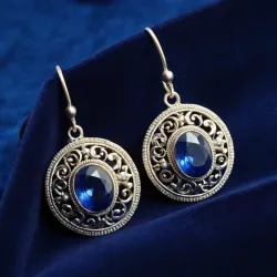 photo of #5 silver earrings with blue gem