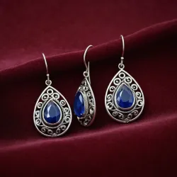 photo of #5 silver earrings with blue gem