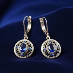 photo of #5 silver earrings with blue gem
