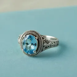 photo of #6 silver ring with light blue gem