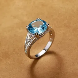 photo of #6 silver ring with light blue gem