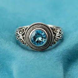 photo of #6 silver ring with light blue gem