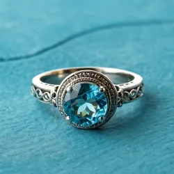 photo of #6 silver ring with light blue gem