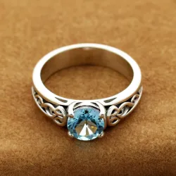 photo of #6 silver ring with light blue gem