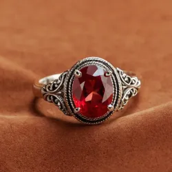 photo of #7 silver ring with light red gem