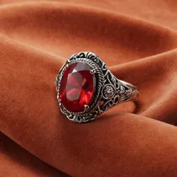 photo of #7 silver ring with light red gem