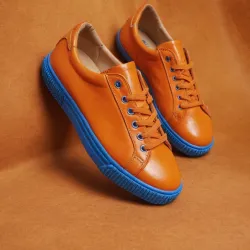 photo of #7 orange sneakers blue sole