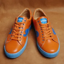 photo of #7 orange sneakers blue sole