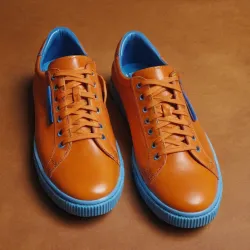 photo of #7 orange sneakers blue sole
