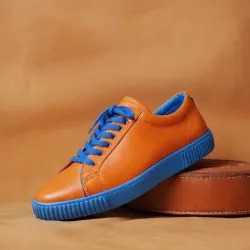 photo of #7 orange sneakers blue sole