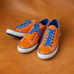 photo of #7 orange sneakers blue sole