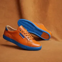 photo of #7 orange sneakers blue sole