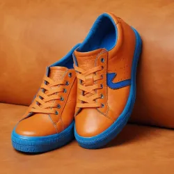 photo of #7 orange sneakers blue sole