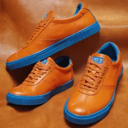 photo of #7 orange sneakers blue sole